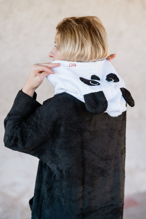 3. Back view of RÄTT unisex bamboo terry poncho with panda hood, highlighting brand logo and design details