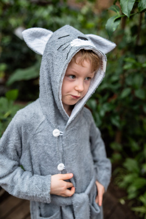 2. Boy in grey RÄTT CAT Bamboo Terry Bathrobe with hood and button closure, outdoors