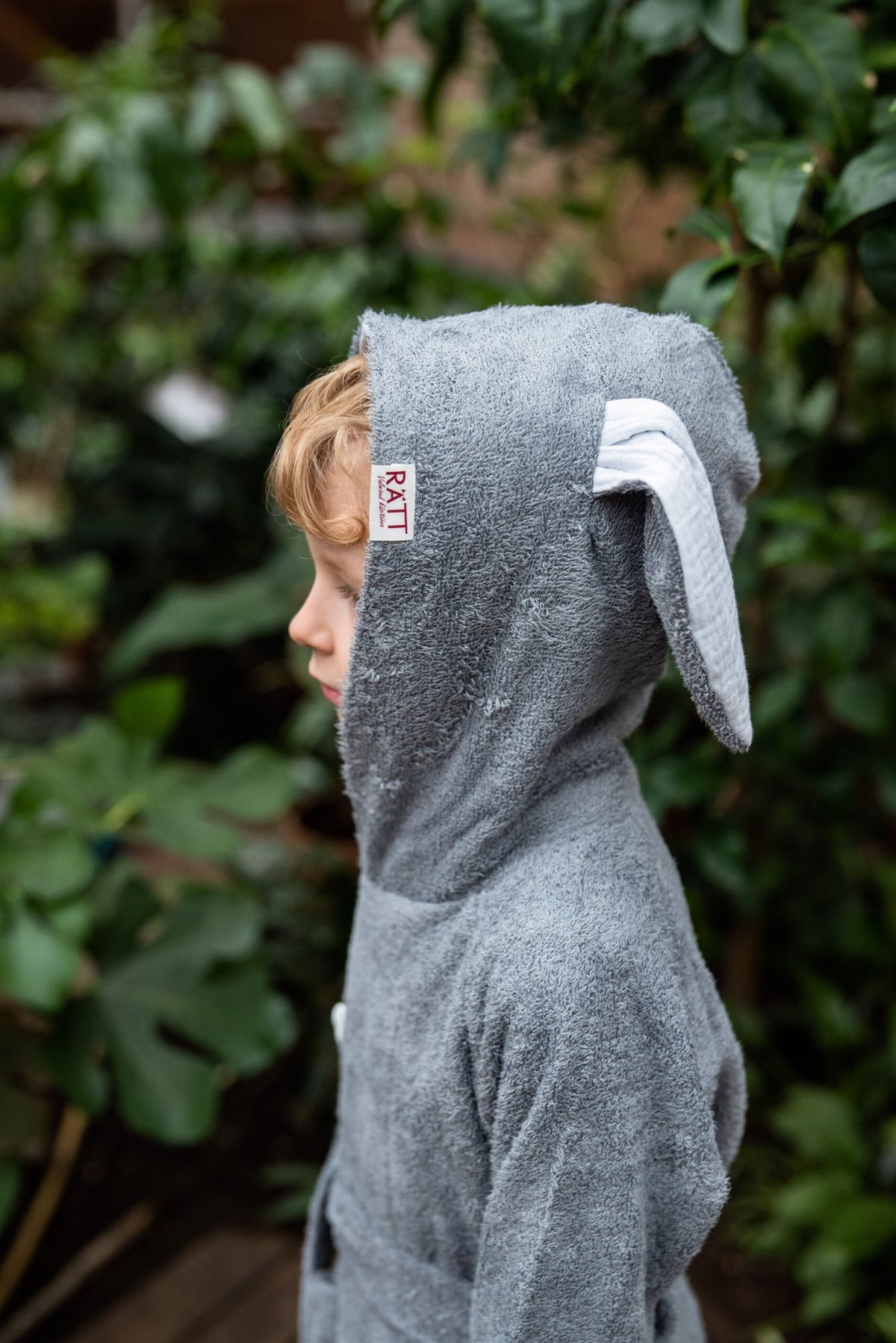 3. Close-up of RÄTT bamboo terry bathrobe BUNNY hood with bunny ears, worn by toddler