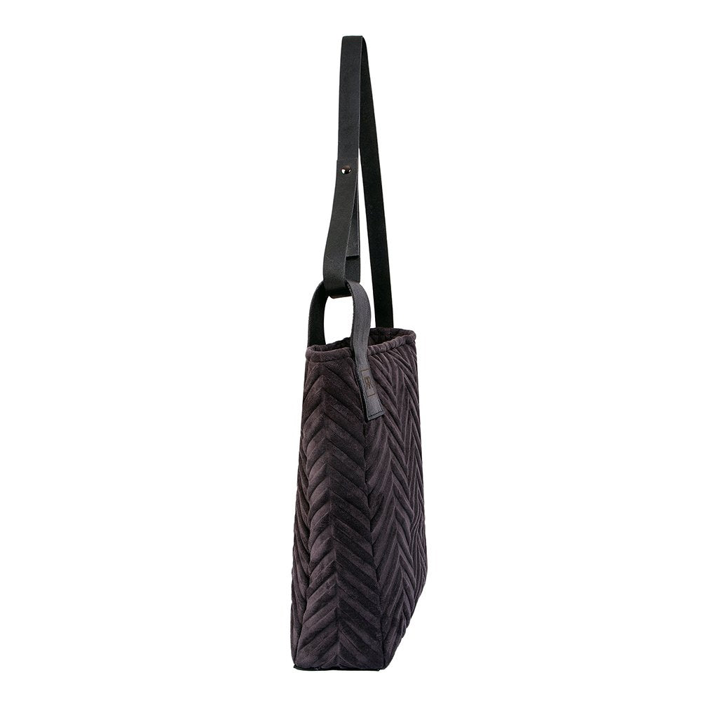 3. Side view of RR mixed material handbag highlighting genuine leather strap and soft-touch fabric