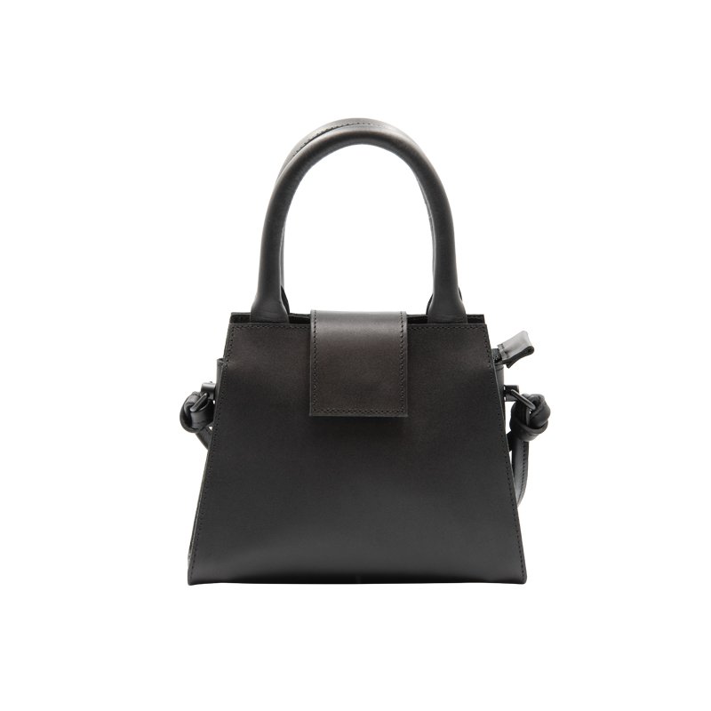 3. Studio shot of RR mini leather handbag with magnetic flap closure and reinforced handles