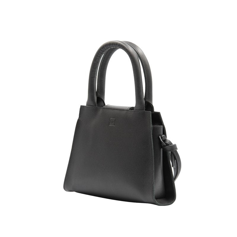 5. Side view of RR mini leather handbag highlighting knot detailing and smooth leather finish