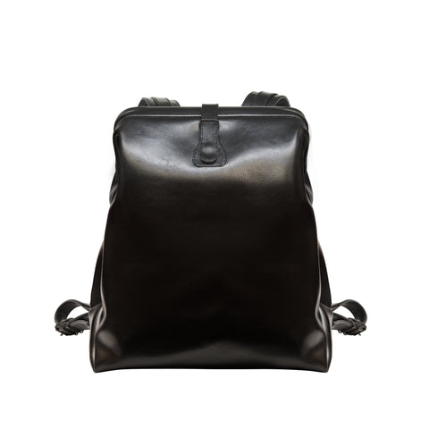1. Black leather backpack by RR with vintage doctor bag design, front view showing pin-buckle closure and sleek finish