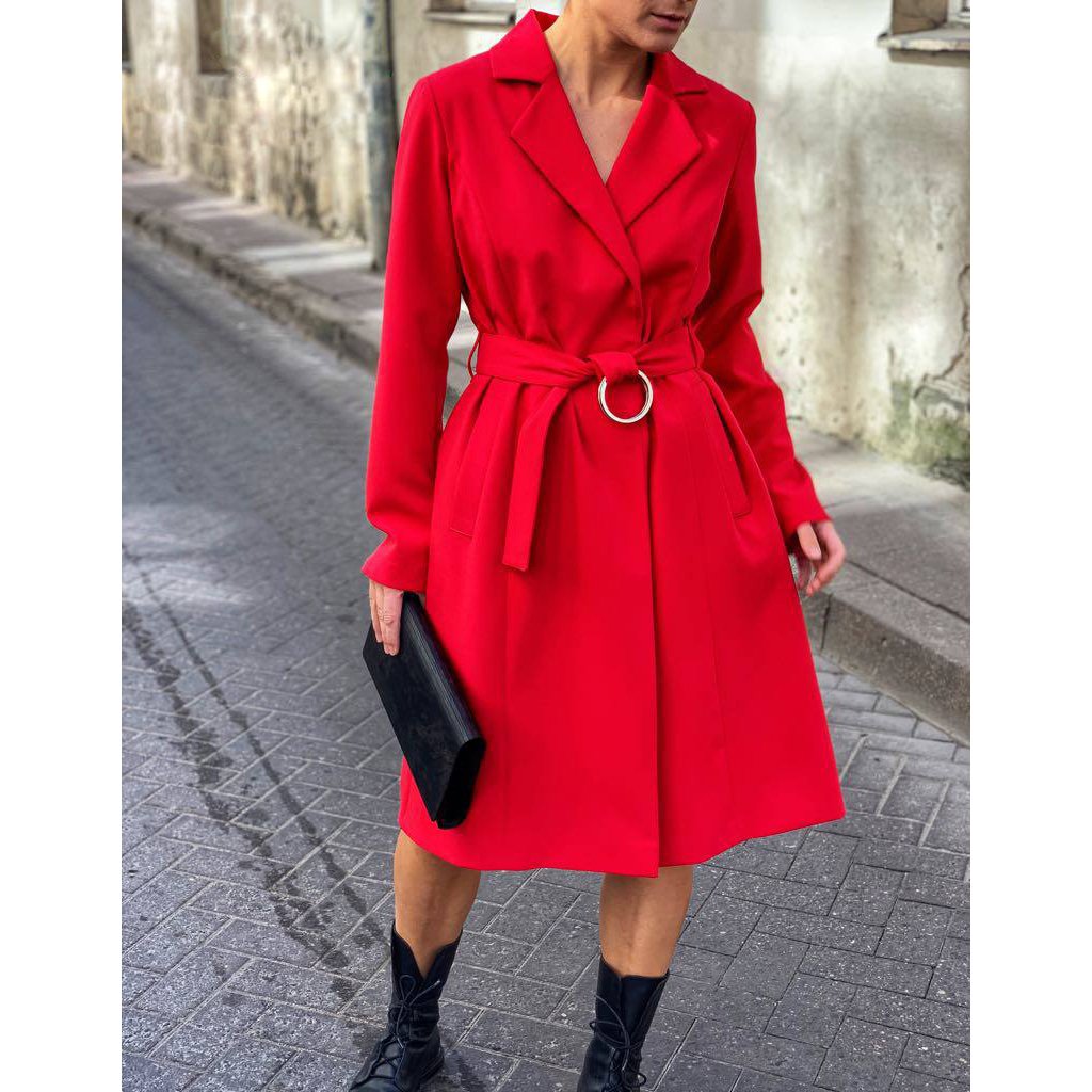 3. Woman in red coat holding large glossy wood clutch by RR, street style setting