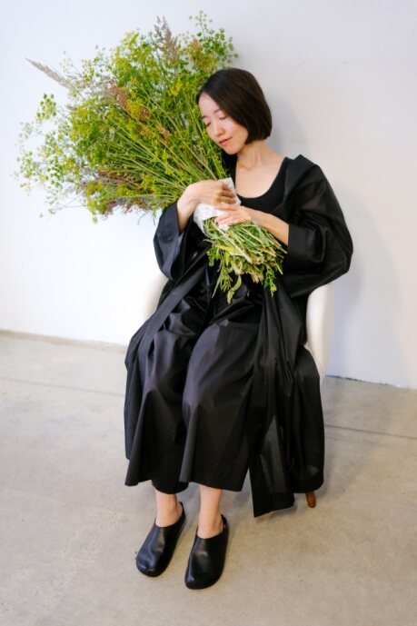 2. Kyoto black slippers by Omaking styled with a black outfit, highlighting natural cork insole and elegant design