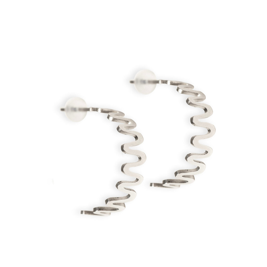 2. Stainless steel hoop earrings with wavy design and soft silicone backing on white background