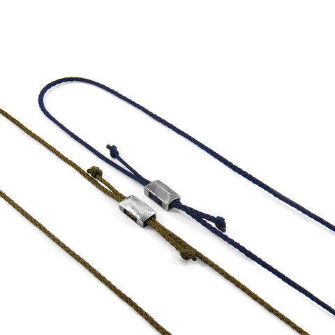 2. Close-up of Edward Silver and Rope SKINNY Bracelets in navy blue and brown, showcasing sterling silver clasps