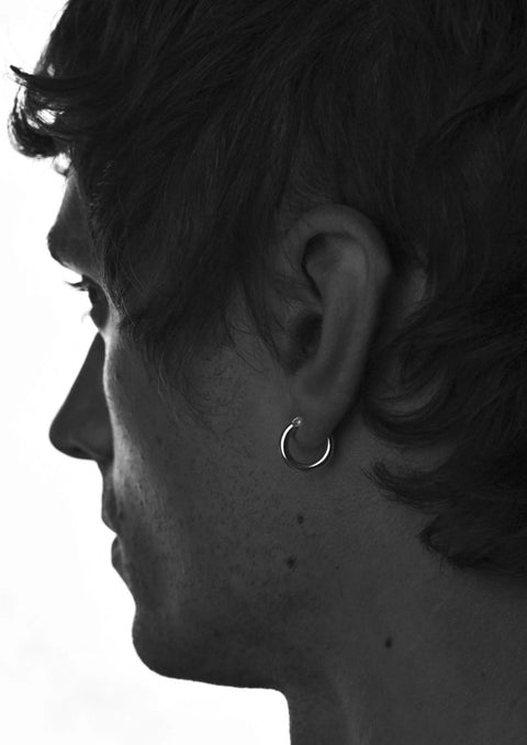 3. Men's Ella Hoops Earring in silver worn by male model, emphasizing unisex appeal and classic style