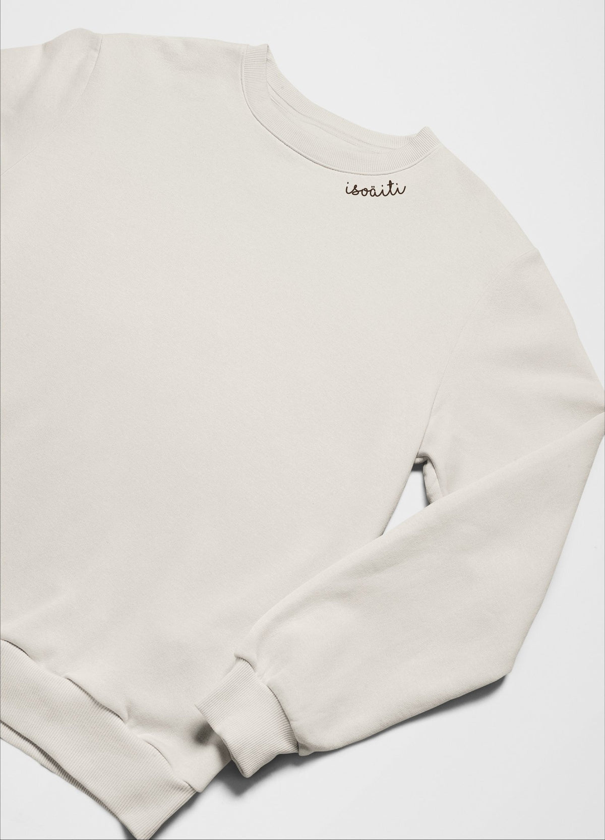 2. Unisex beige embroidered organic cotton sweatshirt by Beebila, displayed flat