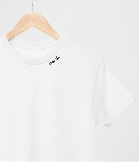 1. White unisex organic cotton t-shirt with embroidered collar by Beebila, shown on hanger in studio