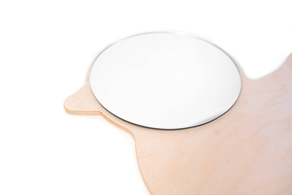 8. Close-up of duck-shaped children's wall mirror with round acrylic mirror and plywood frame