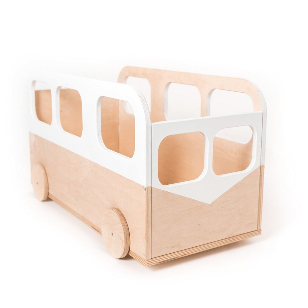 3. Studio shot of Ewart Woods kids toy storage box on wheels, designed as a bus, with a white and natural wood finish