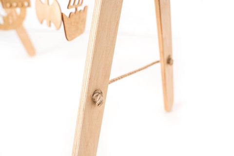 3. Close-up of wooden play gym leg showing natural wood texture and construction