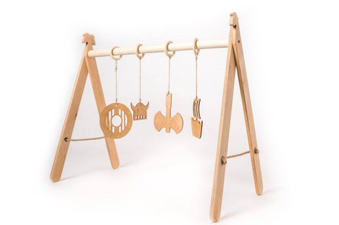 2. Wooden baby play gym with Viking-themed hanging toys on a white background