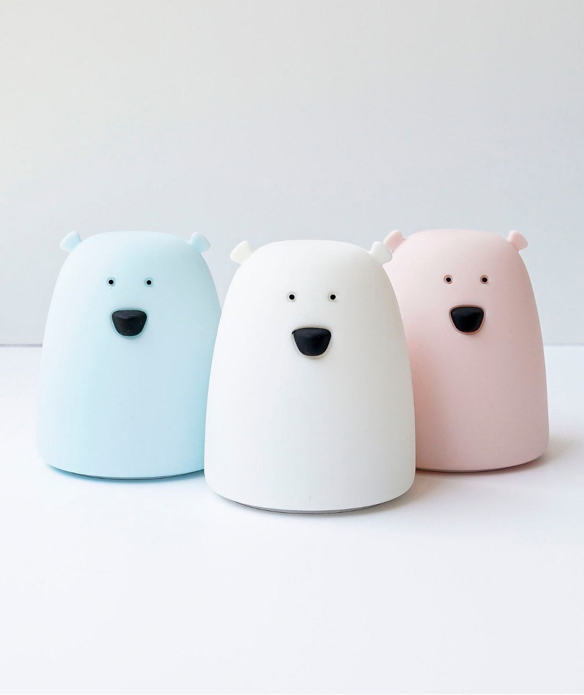 1. Three Little Bear silicone lamps in pink, white, and blue on a white surface