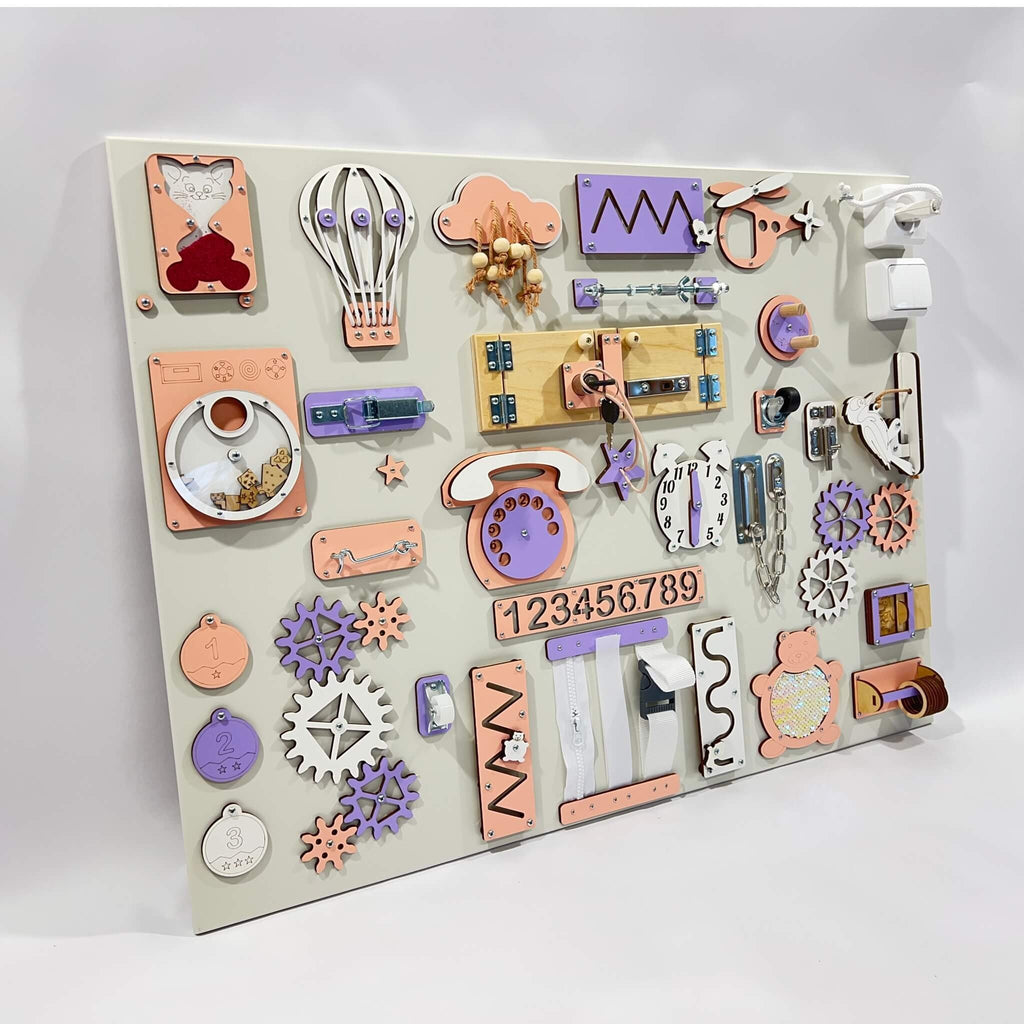 3. Studio shot of BusyBunnyToys extra large Montessori busy board with activities in pastel colors, including purple and peach, for toddler engagement.