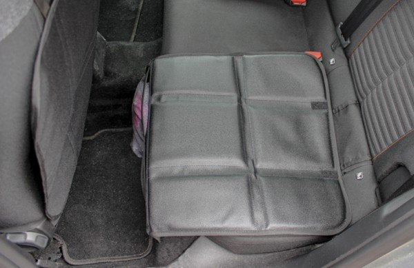 2. Ezi Mat 3 in 1 seat protector installed on rear car seat, showing adjustable fit