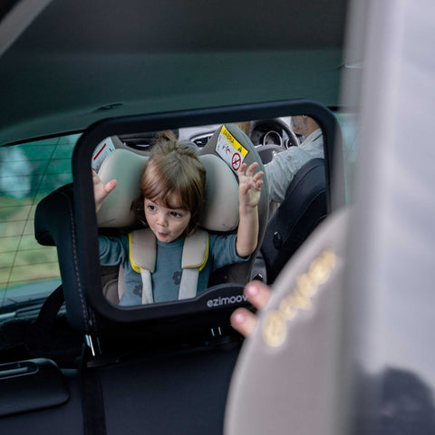 4. Child in car seat seen through Ezimoov EZI MIRROR SQUARE, emphasizing mirror's wide angle and safety