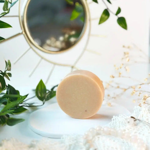 4. Vegan Fox Face Cleanser Bar with Pink Clay on white surface with mirror and plants