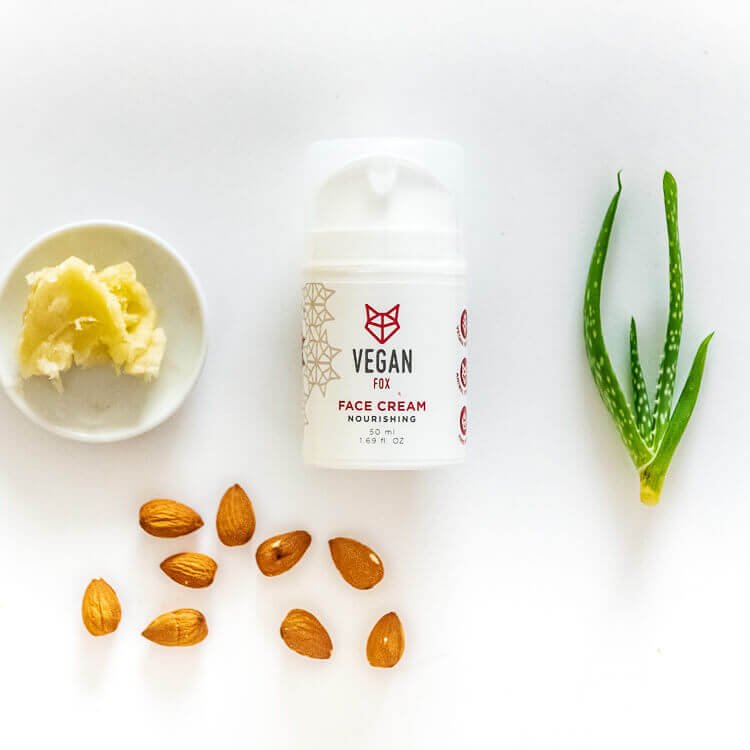6. Flat lay of Vegan Fox nourishing face cream with almonds, aloe, and shea butter, showcasing key ingredients