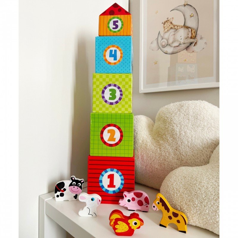 2. Stacked colorful cubes with numbers and animal figurines on a white shelf