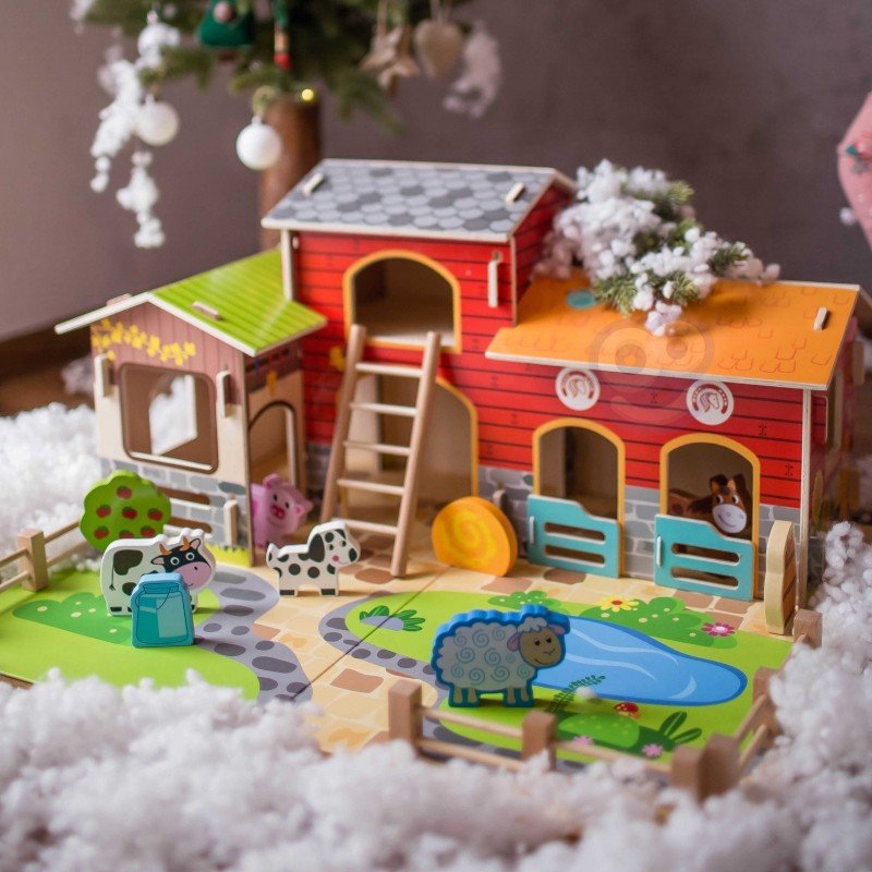 2. Woopie Green Mega Farm set displayed with barn, stable, and animal figurines, surrounded by decorative snow