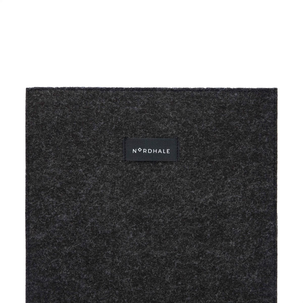 4. Close-up of Nordhale branding on black felt laptop sleeve