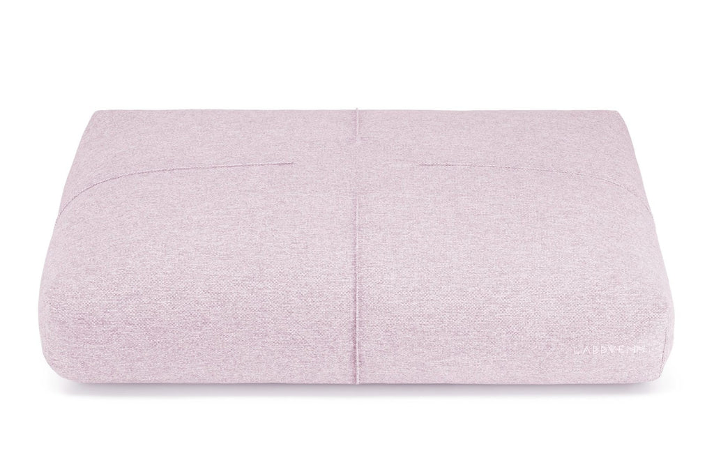 2. Rose-colored Finno dog cushion by Labbvenn with decorative stitching shown on a white background highlighting its rectangular shape and brand logo