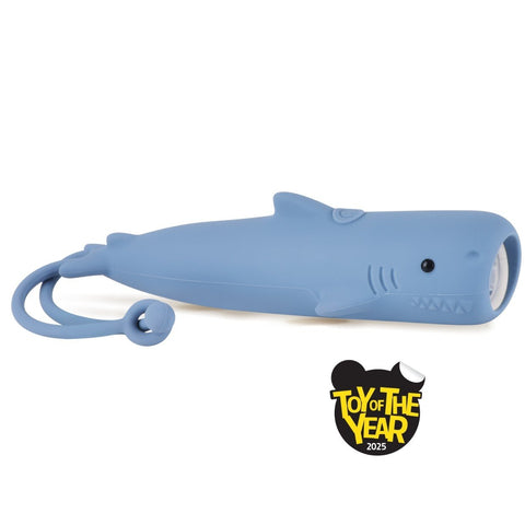 2. Blue shark-shaped silicone flashlight with USB-C charging and hanger, awarded Toy of the Year 2025