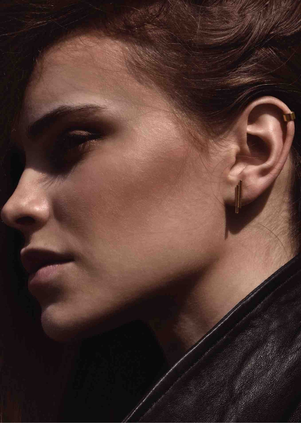 1. Women's gold flat upper ear cuff by NO MORE, worn by model, showcasing elegant and sophisticated style in lifestyle setting