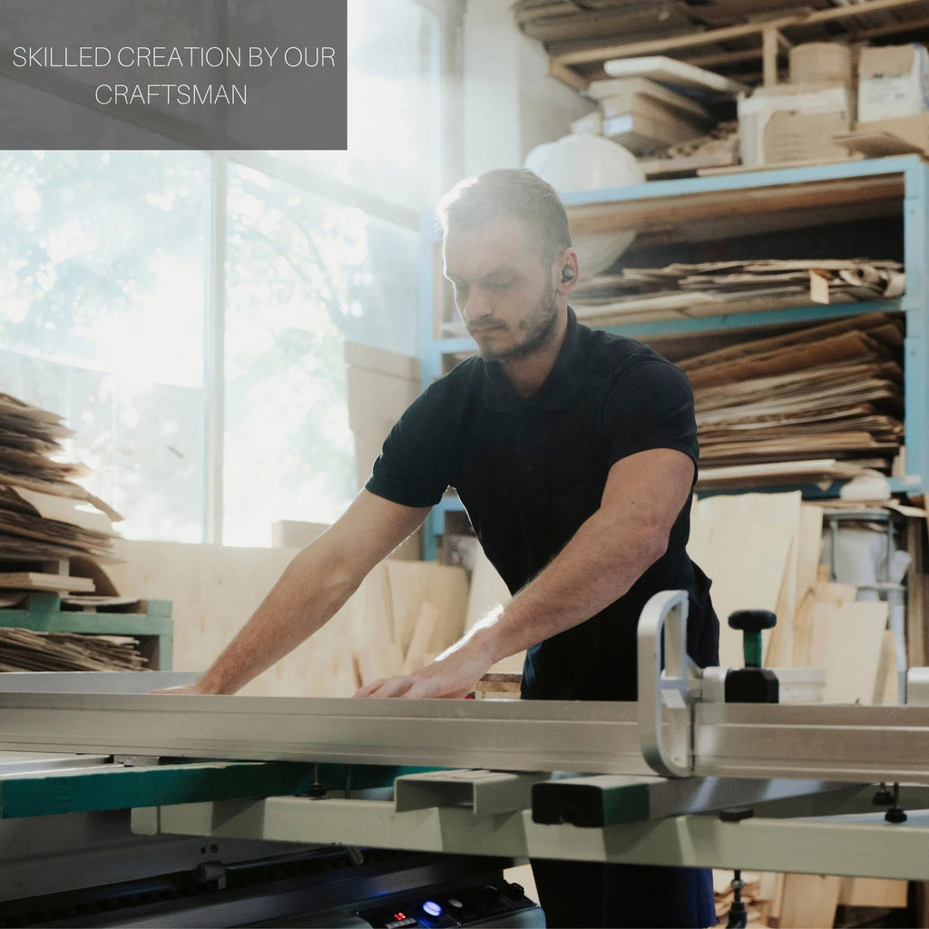 2. Craftsman in workshop creating wooden furniture with natural light streaming through window
