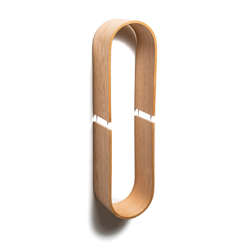 2. Vertical view of oval wooden wall shelf against white background