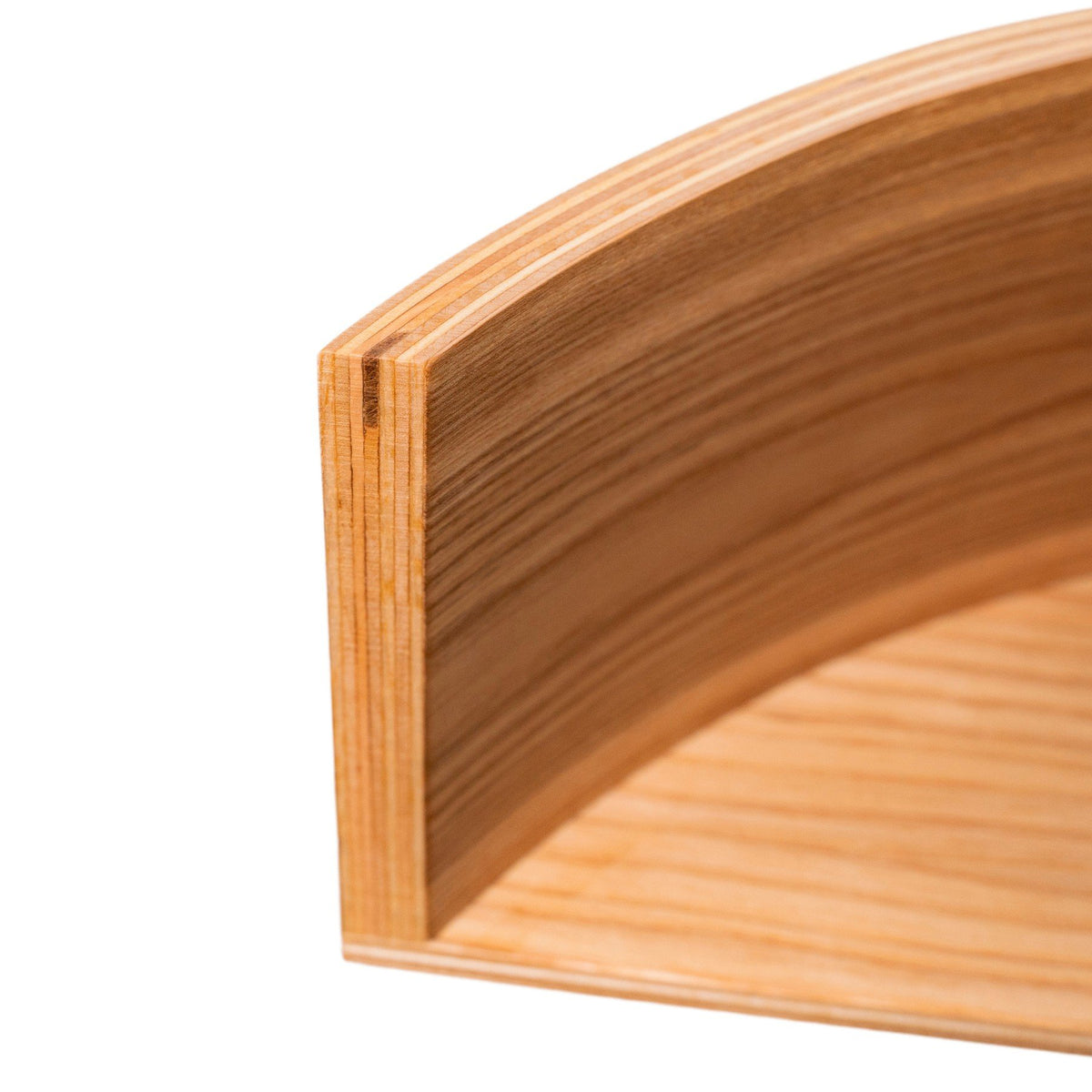 3. Detail shot of curved edge on floating wooden wall shelf, showcasing birch plywood layers