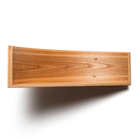2. Studio shot of floating wooden wall shelf with curved edges and natural wood finish