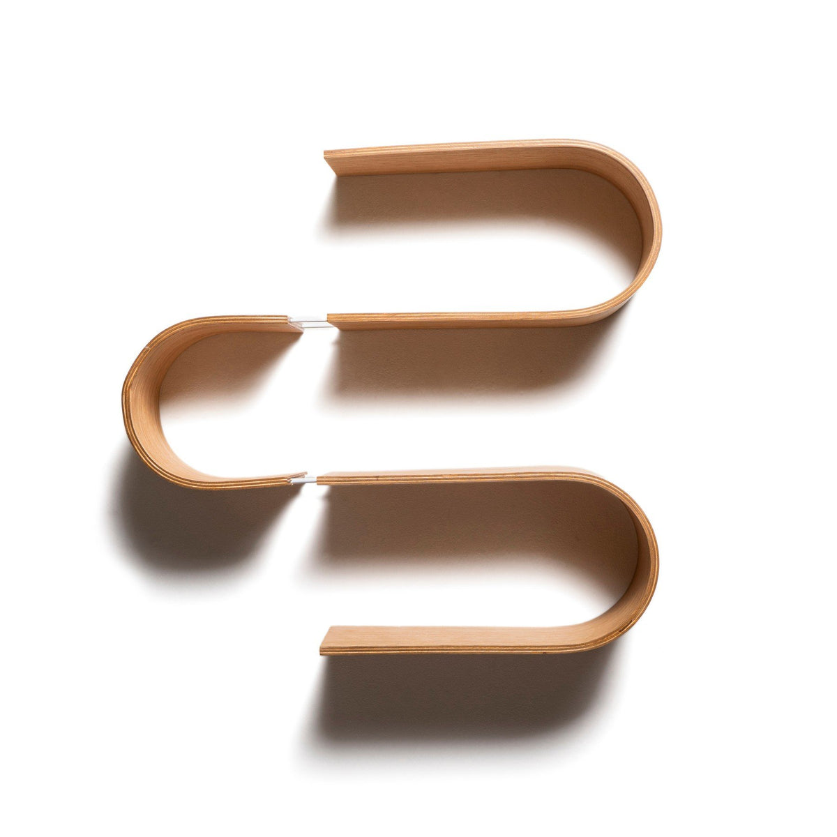 6. Flat lay of S-shaped floating wooden wall shelf showing its unique design and craftsmanship