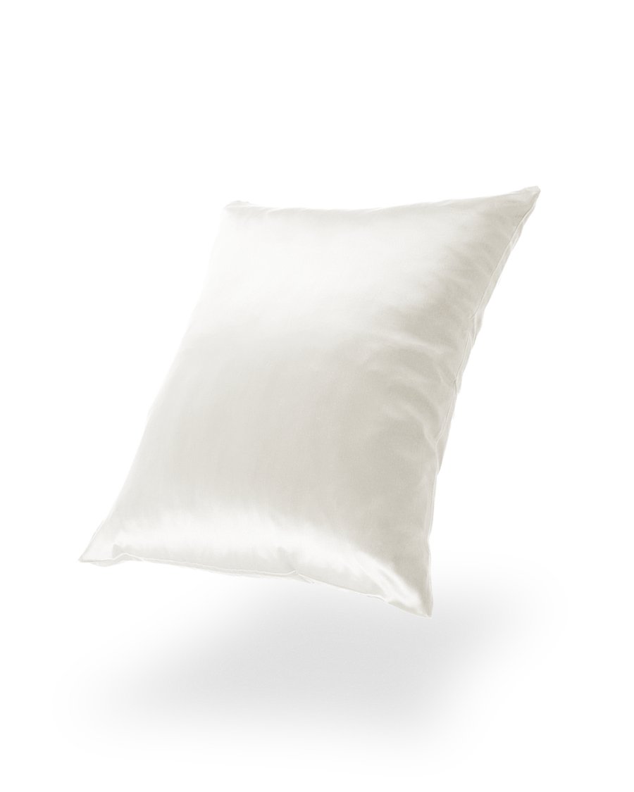 23. White silk pillowcase on black background, showcasing luxurious sheen