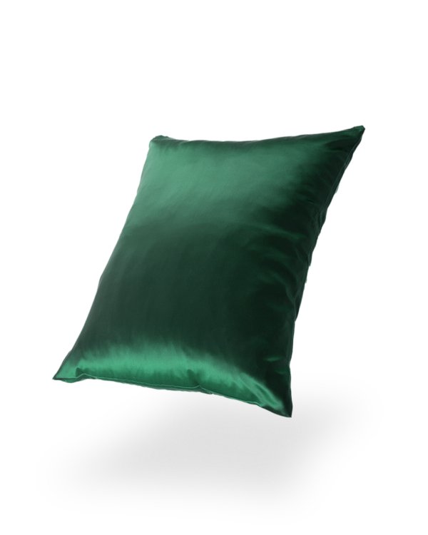 9. Green Mulberry silk pillowcase floating against a black background, emphasizing richness