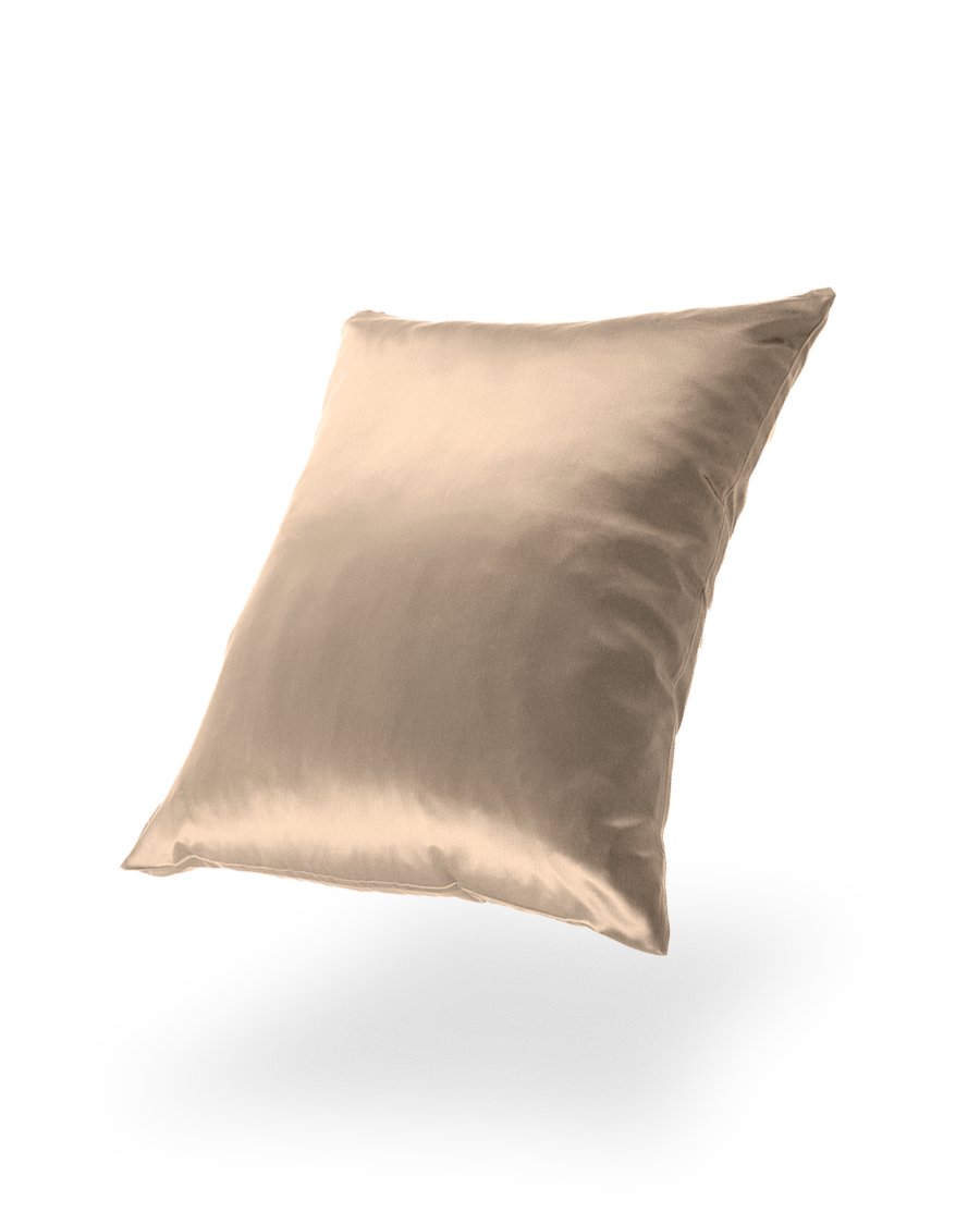 14. Gold Mulberry silk pillowcase floating against a black background, emphasizing luxury
