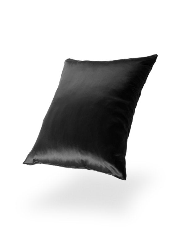 22. Black silk pillowcase on black background, highlighting elegant texture