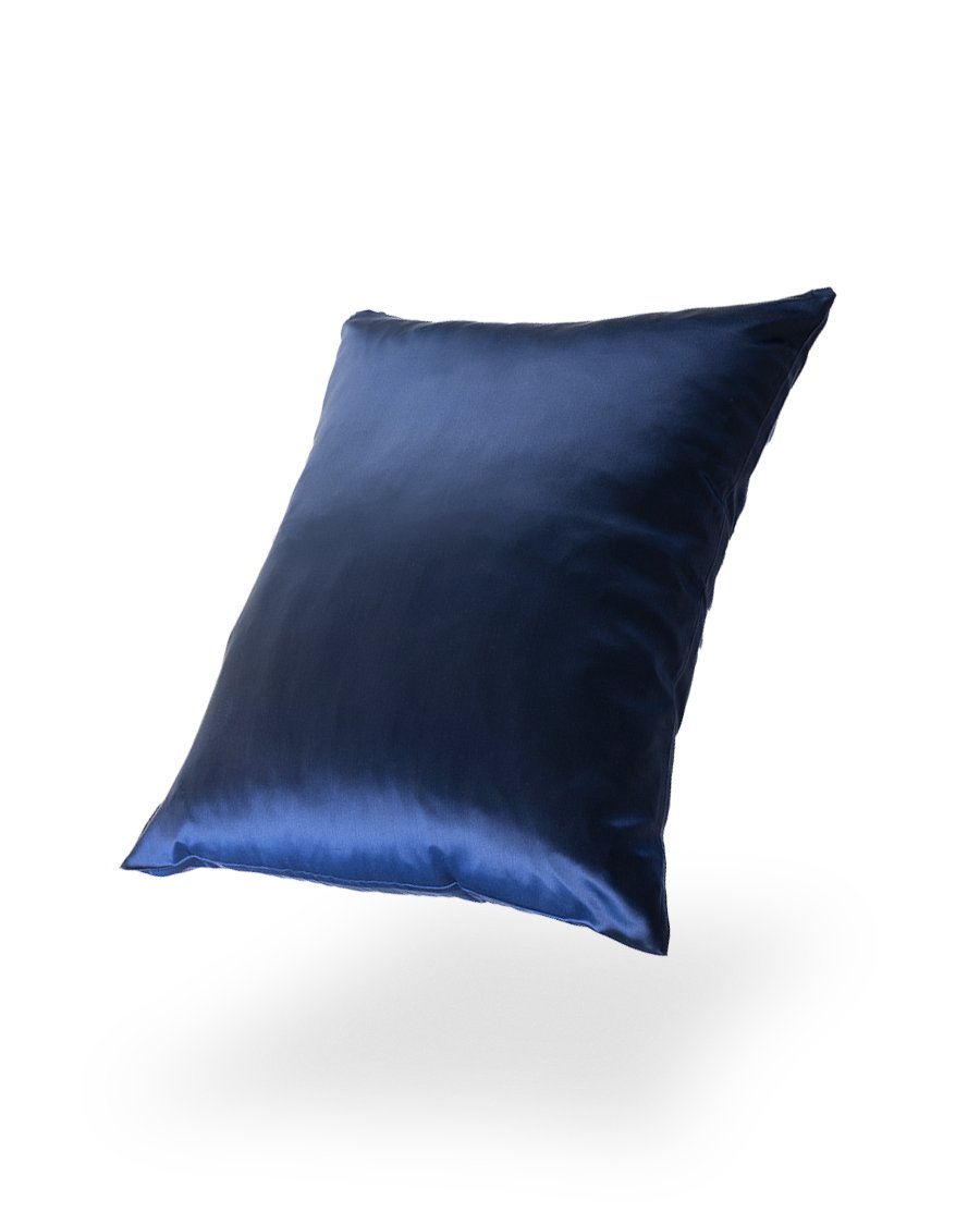 6. Blue Mulberry silk pillowcase floating against a black background, emphasizing color