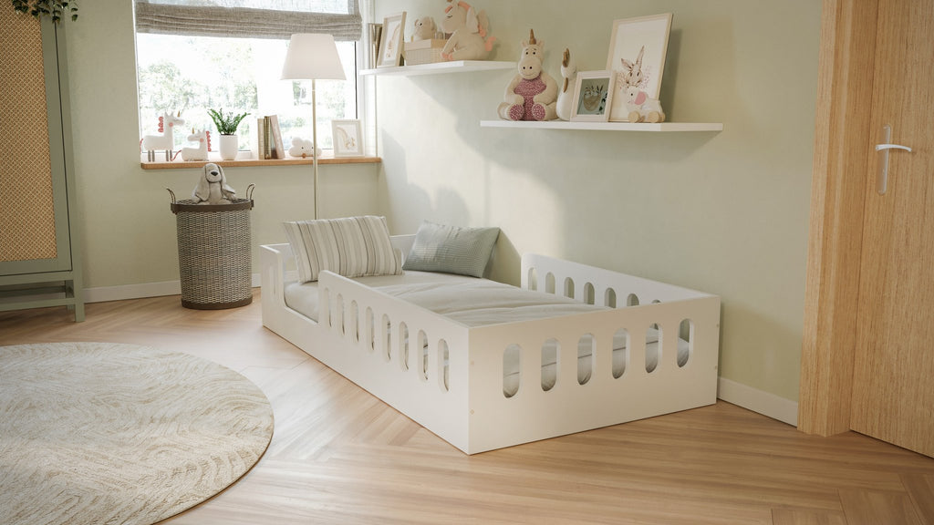 1. White floor bed in children's room with striped pillows and soft lighting, enhancing a playful atmosphere