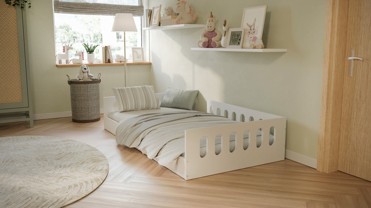 1. Kids' room with white Montessori floor bed, striped bedding, and decorative shelves in a cozy setting