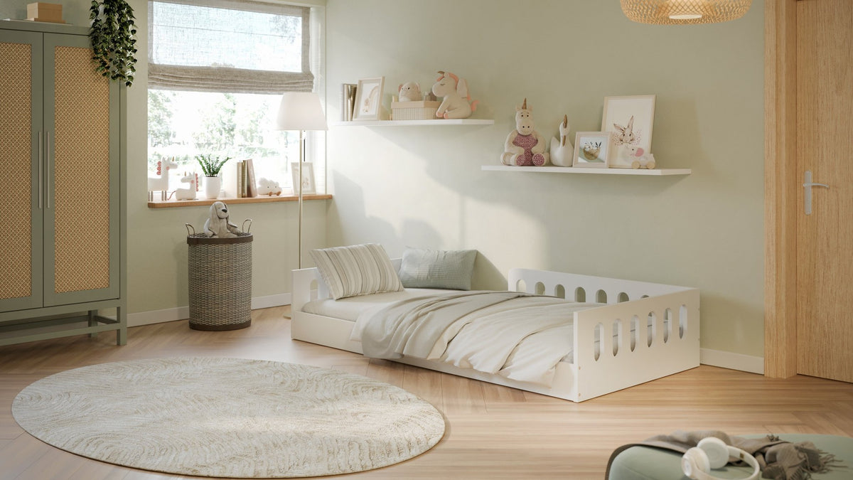 1. Cozy kids' room with white floor bed, striped bedding, and soft natural light