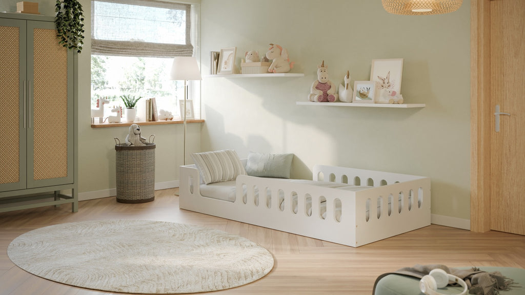1. Bright children's room featuring white floor bed with decorative pillows and wall art