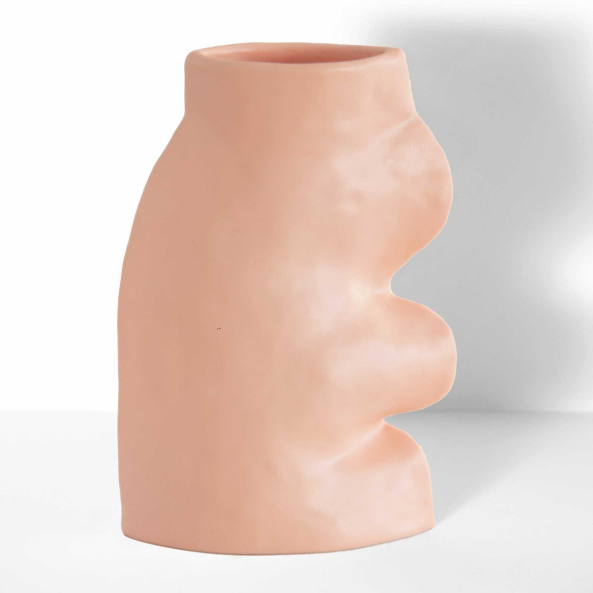 4. Studio shot of Fluxo Ceramic Vase Large in pink by 5mm Paper, highlighting its handcrafted flowing design