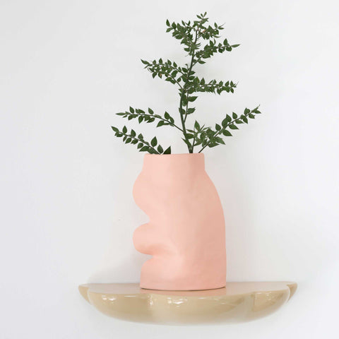 1. Fluxo Ceramic Vase Large in pink by 5mm Paper, displayed on a shelf with greenery, showcasing its unique flowing design