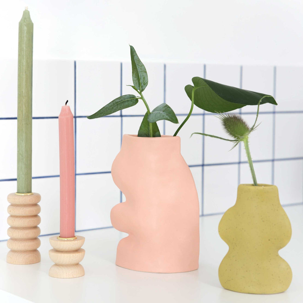 3. Fluxo Ceramic Vase Large in pink by 5mm Paper, paired with a yellow vase and candles, set against a tiled background