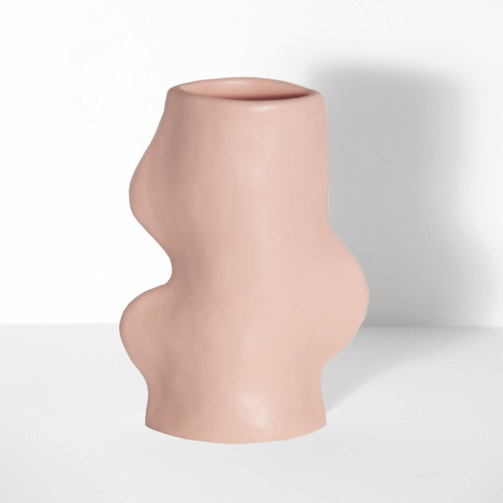 2. Studio shot of Fluxo Ceramic Vase in pink, highlighting its handcrafted flowing lines and modern design