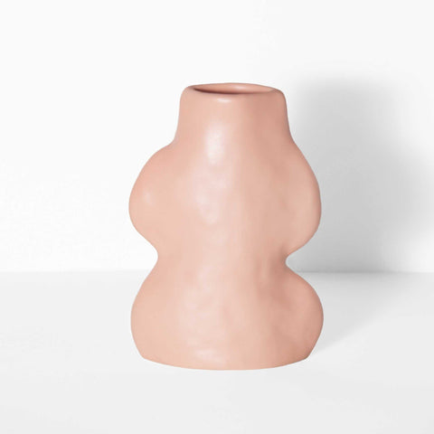 2. Studio shot of Fluxo Ceramic Vase Small in pink by 5mm Paper, highlighting its unique flowing design