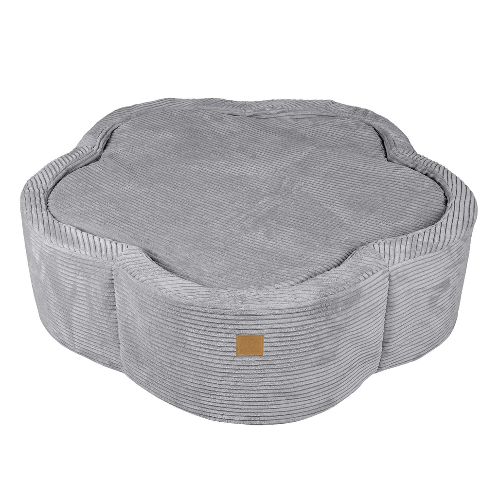 4. Flat lay of grey flower-shaped foam baby ball pit with ribbed texture and a small brown logo patch